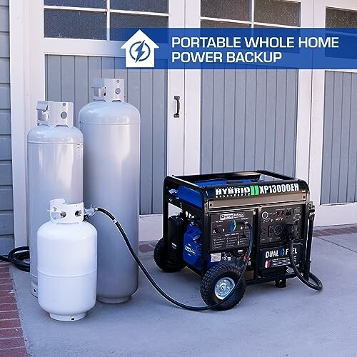 Portable generator connected to propane tanks for home power backup.